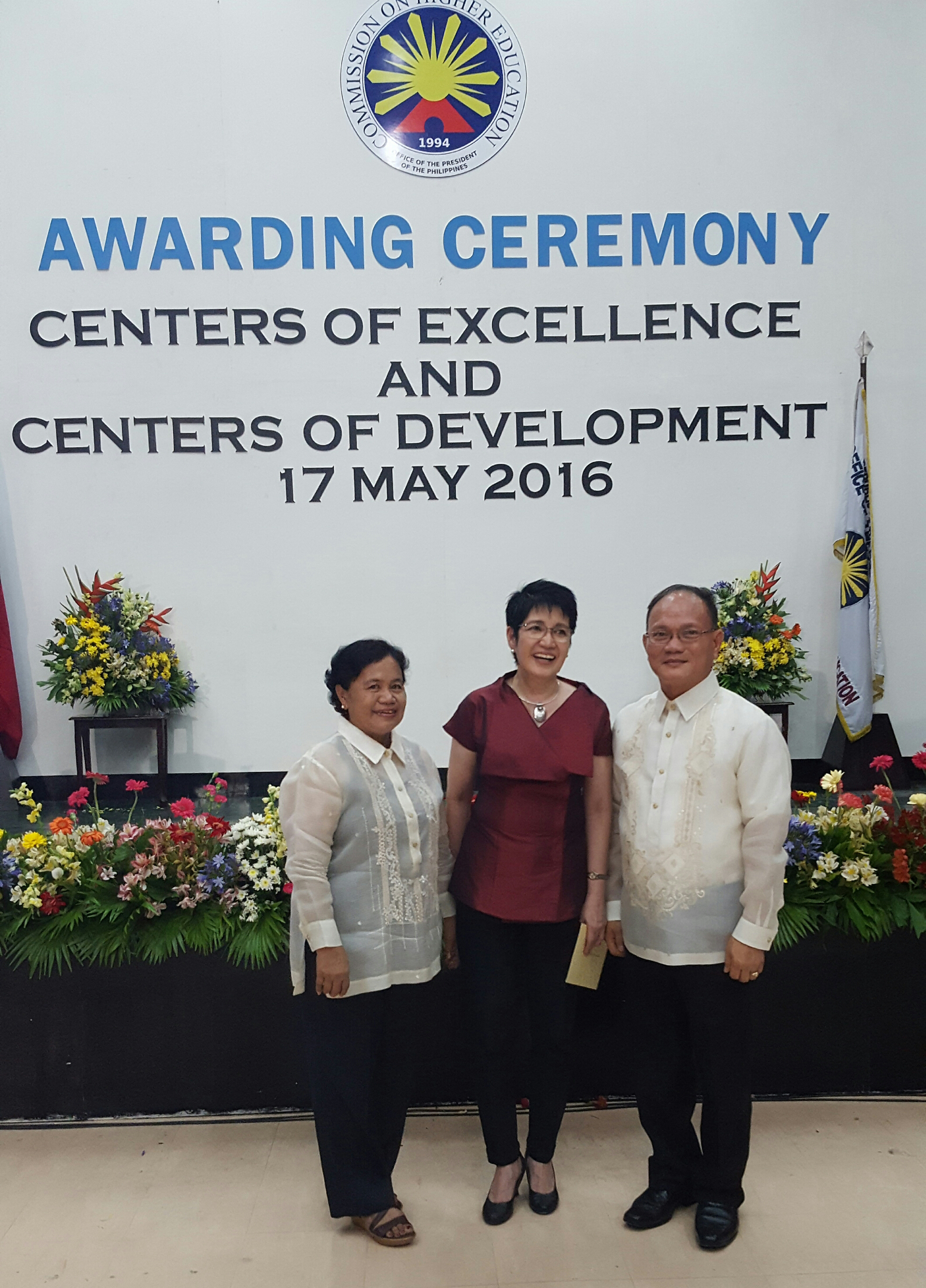 Commissioner Cynthia Bautista, Chairman, ISAT U Board of Regents with Dr. Muyong and Dr. Ecahveria during the awarding at CHED central office.