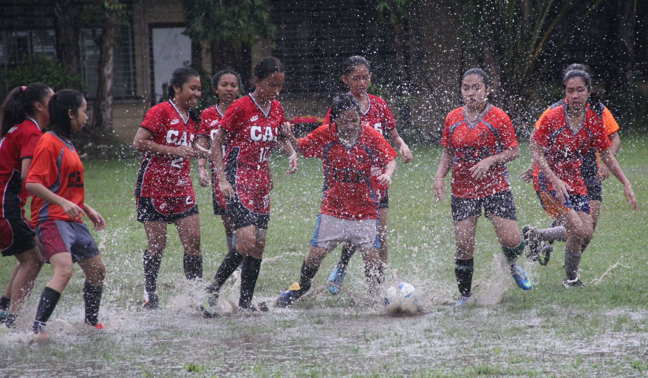 Football in the rain at ISAT U football field.