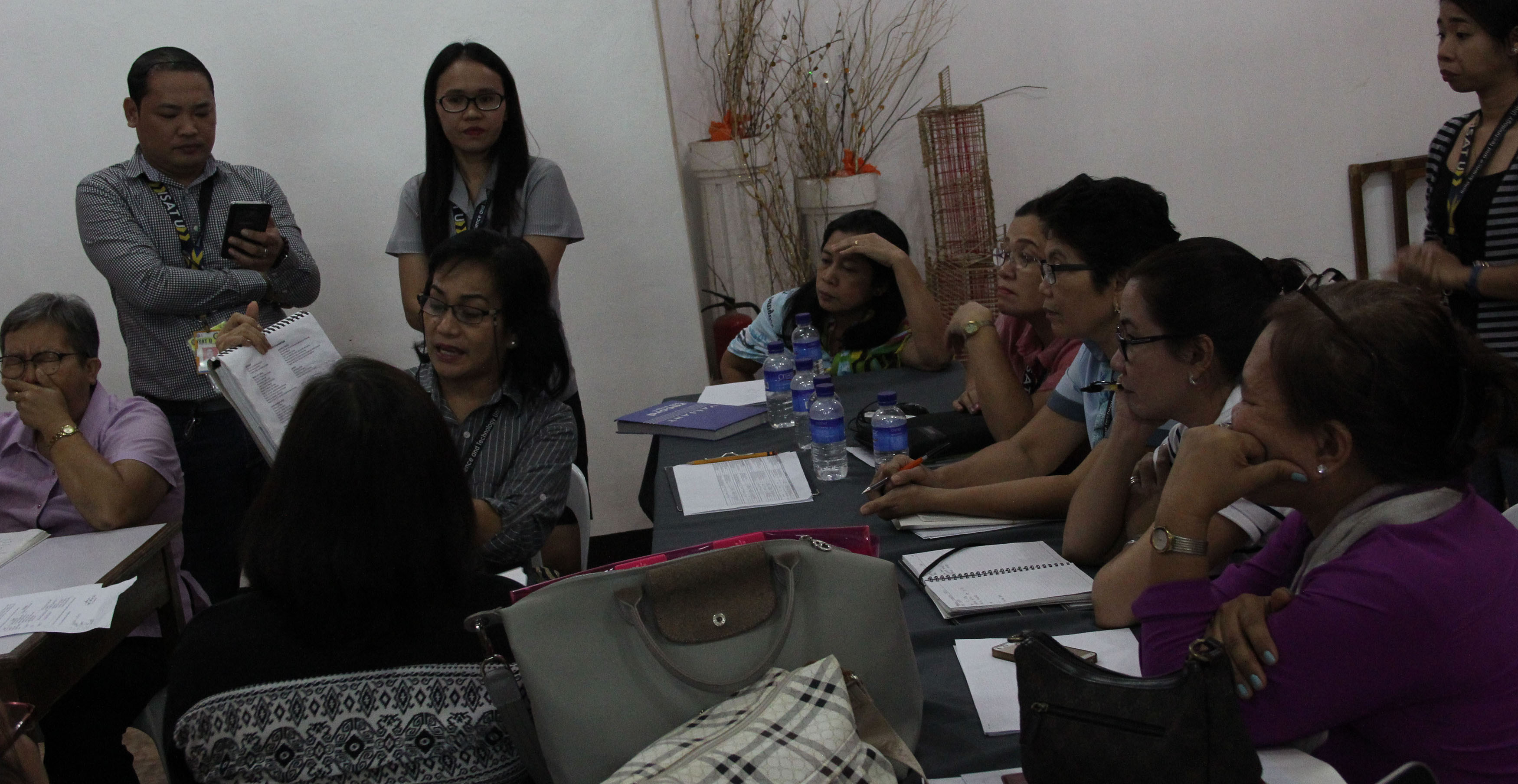 Dr. Nehema K. Misola, VP for Administration and Finance, and members of the Full Time Delivery Unit examines closely the report submitted during the meeting.