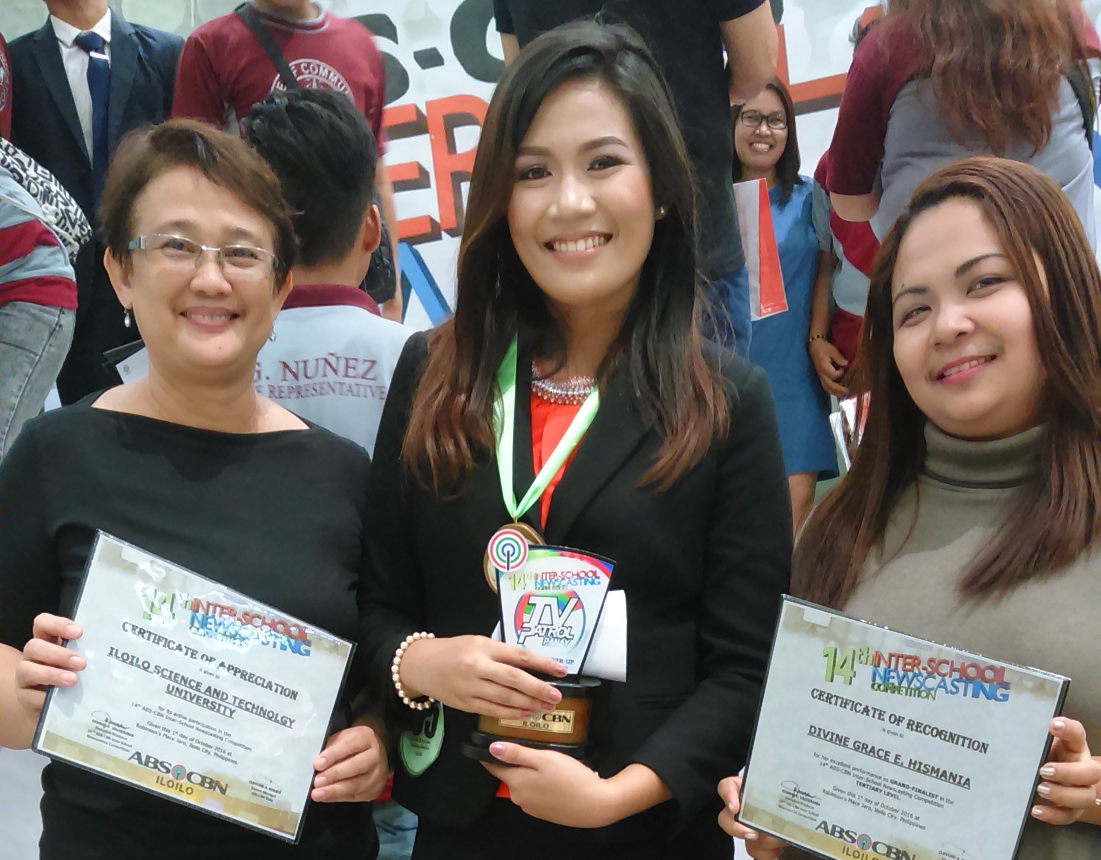 Divine Marie E. Hismana is flanked by her coaches Dr. Belen R. Balandra (left) and Ms. Yvonne Pampag. Hismana will represent ISAT U in the Regional competition. 