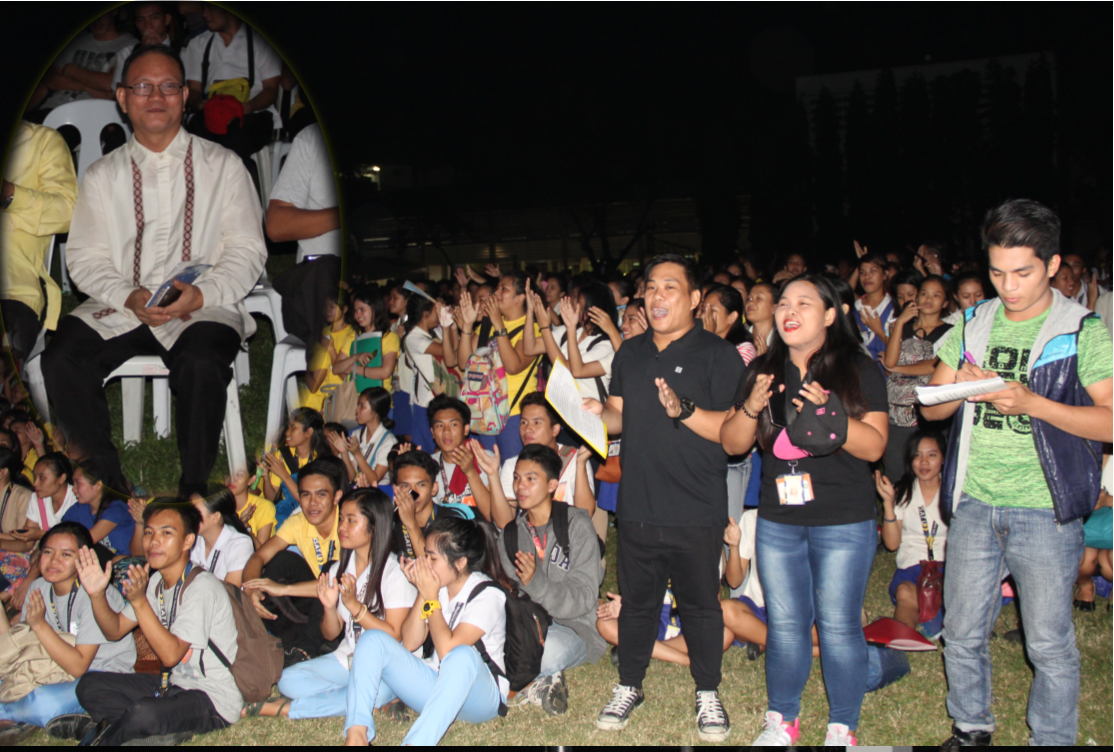 With the accompaniment of the ISAT U band, the students sing a birthday song as an advance greetings to Dr. Raul F. Muyong (inset).