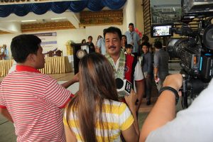 Commissioner De Vera answers questions from the press after the open forum at the ISAT U Iloilo City Campus.